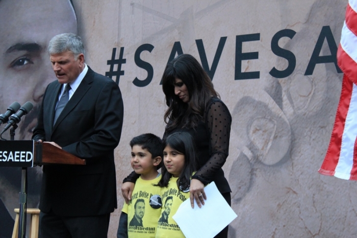 The Reverend Franklin Graham, CEO of Samaritan's Purse, leads a group in prayer at a vigil for imprisoned Iranian-American Pastor Saeed Abedini in Lafayette Square, Washington, September 25, 2014. Naghmeh Abedini (R), wife of Pastor Saeed, and their two children.