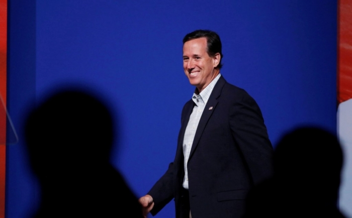 Former U.S. Sen. Rick Santorum, R-Pa., walks in to speak during the second day at the 5th annual Faith & Freedom Coalition's 'Road to Majority' Policy Conference in Washington, June 20, 2014.