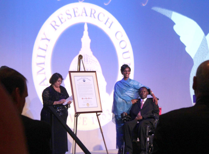 Meriam Ibrahim and husband, Daniel Wani, accept the Family Research Council's first ever Cost of Discipleship award at the ninth annual Values Voter Summit Gala in Washington, Saturday, September 27, 2014.