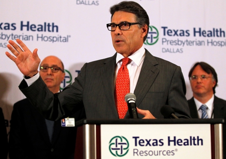 Texas Governor Rick Perry speaks at a media conference at Texas Health Presbyterian Hospital in Dallas, Texas October 1, 2014. U.S. health experts in Dallas on Wednesday were examining how many people may have been exposed to Ebola, just one day after the first case of the deadly virus was diagnosed in the United States, the nation's top public health official said.