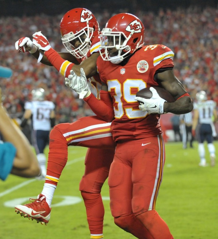 Kansas City Chiefs free safety Husain Abdullah (39) is congratulated by cornerback Sean Smith (21) after scoring during the second half against the New England Patriots at Arrowhead Stadium. The Chiefs won 41-14, Kansas City, Missouri, September 29, 2014.