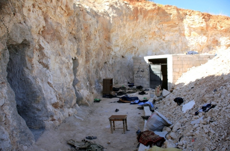 A base where caves were dug by rebel fighters in Zor al-Mahruqa village is seen, after forces of Syria's President Bashar al-Assad said they had regained control of the area and its surrounding hills, in Hama countryside, October 6, 2014.