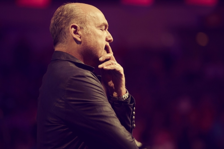 Greg Laurie, senior pastor of Harvest Christian Fellowship in Riverside, California and Harvest Orange County in Irvine, California, shares the Gospel with a sold-out crowd of 19,000 for Harvest America at the American Airlines Center and Victory Park in Dallas, Texas, Oct. 5, 2014.