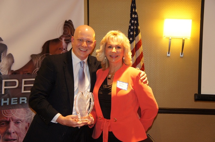 Christopher Doyle (L) presents Sandy Rios (R) with the Friend of Ex-Gays Freedom Award at second annual Ex-Gay Awareness Month Conference held in Washington, Oct. 3-4, 2014.