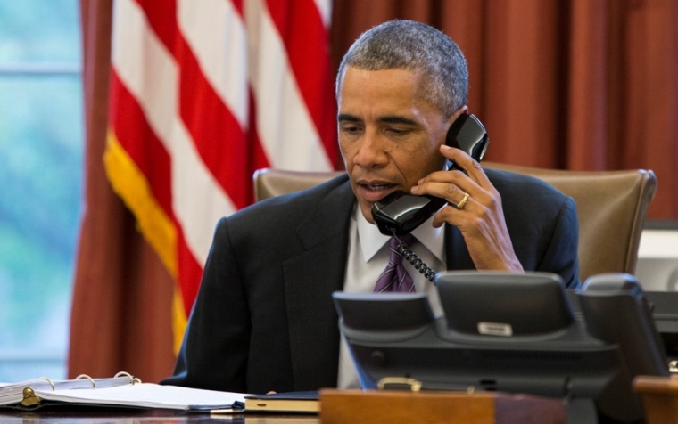 U.S. President Barack Obama participates in a conference call with state and local officials to discuss the Administration's domestic preparedness response to the Ebola epidemic in West Africa, in the Oval Office of the White House in Washington, October 8, 2014. A Liberian man, Thomas Eric Duncan, who was the first person diagnosed with Ebola in the United States died in a Texas hospital on Wednesday, his case having put health authorities on alert for the.S. President Barack Obama deadly virus spreading outside of West Africa.
