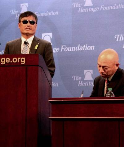 Chen Guangcheng (L) speaks at a Heritage Foundation event in Washington, D.C., Oct. 9, 2014. Guangcheng spoke of the atrocities that are happening to women and their husbands in China as a result of the Chinese government's one-child policy.