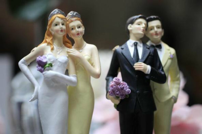 Same-sex couple plastic figurines are displayed during a gay wedding fair in Paris in this April 27, 2013, file photo.