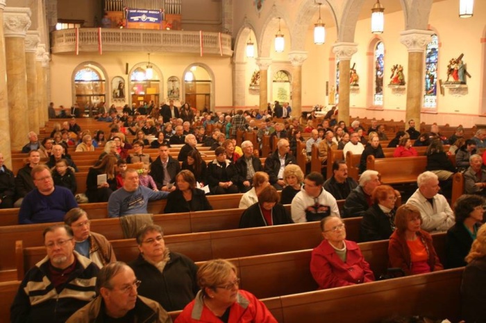 Buffalo Mass Mob comes to Saint Adalbert Basilica of Buffalo, New York, in November 2013. Inspired by 'flash mobs,' the Mass Mob involves large numbers of people attending mass at one of Buffalo's struggling Roman catholic churches.
