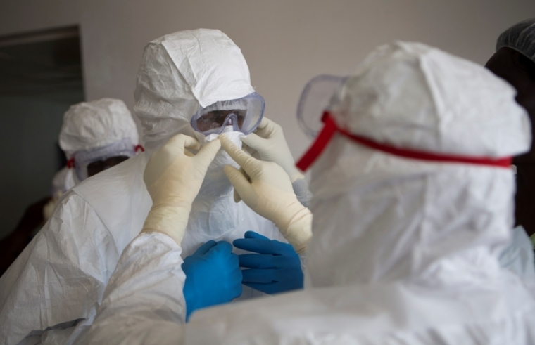 Health workers wearing protective equipment are pictured at the Island Clinic in Monrovia, September 30, 2014, where patients are treated for Ebola.