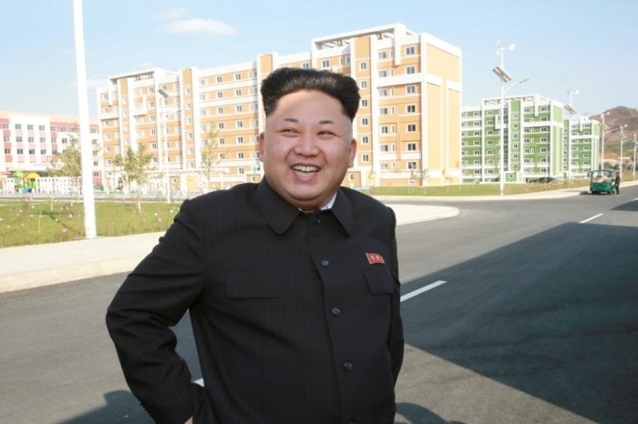 North Korean leader Kim Jong Un gives field guidance to the newly built Wisong Scientists Residential District in this undated photo released by North Korea's Korean Central News Agency in Pyongyang, October 14, 2014.