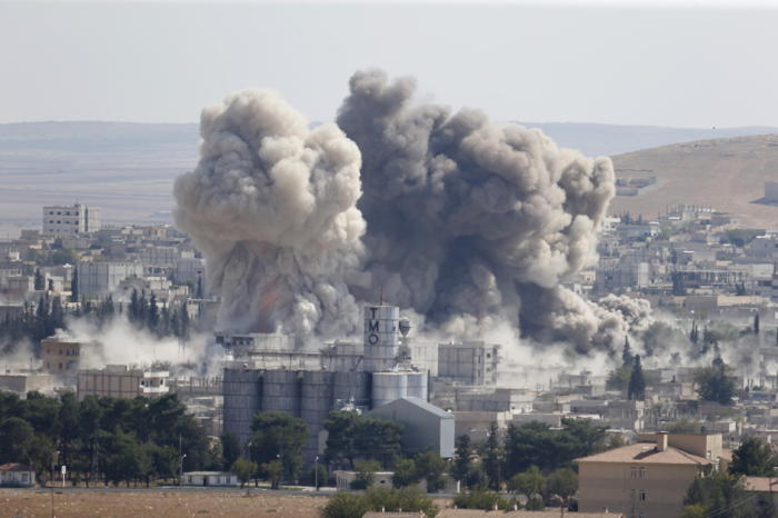 Smoke rises after U.S.-led airstrike attempting to stop Islamic State advances strikes down in the Syrian town of Kobane.