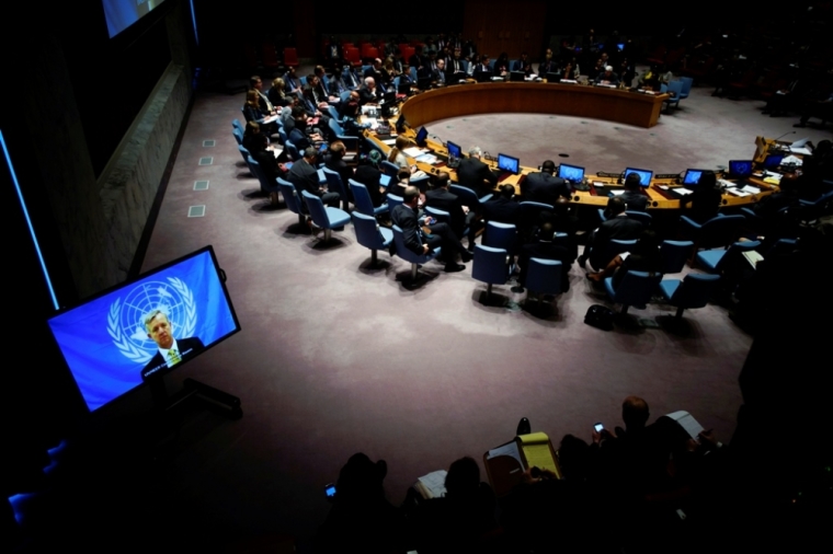 U.N. Ebola mission chief Anthony Banbury (on Screen) speaks to members of the United Nations Security Council during a meeting on the Ebola crisis at the U.N. headquarters in New York, October 14, 2014.