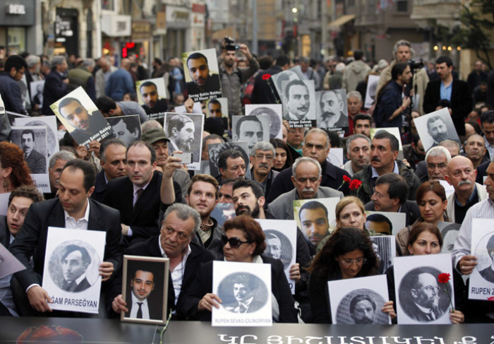 Activists hold pictures of Armenian victims during a demonstration to commemorate the 1915 mass killing of Armenians in the Ottoman Empire, in Istanbul April 24, 2014.