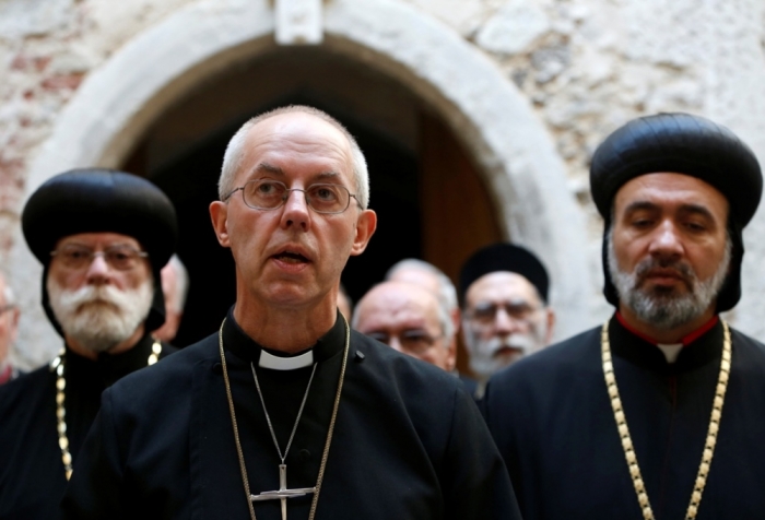 The Archbishop of Canterbury Justin Welby speaks to the media following a meeting of leaders and representatives of the Middle East churches based in the United Kigndom, at Lambeth Palace in London, England, September 3, 2014.
