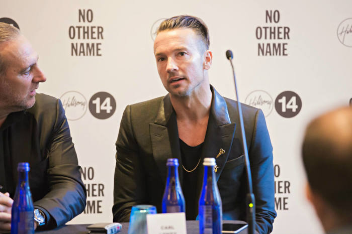 Pastor Brian Houston of Hillsong Church looks on as Hillsong NYC pastor Carl Lentz speaks during a press conference on Thursday, Oct. 16, 2014, at The Eventi Hotel in New York City. The press conference came on the occasion of the Hillsong Conference being held at Madison Square Garden from Oct. 16-18 in NYC.
