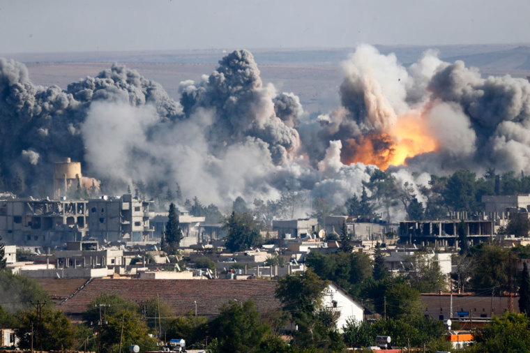 Smoke rises over Syrian town of Kobani after an airstrike, as seen from the Mursitpinar border crossing on the Turkish-Syrian border in the southeastern town of Suruc in Sanliurfa province, October 18, 2014. U.S.-led coalition jets pounded suspected Islamic State targets at least six times in the besieged Syrian town of Kobani on Saturday after the fiercest shelling in days by the insurgents shook the town's centre and hit border areas within Turkey.