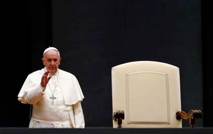 Pope Francis arrives to take part in a vigil to mark the opening of the Synod on the family in Saint Peter's Square at the Vatican, October 4, 2014.