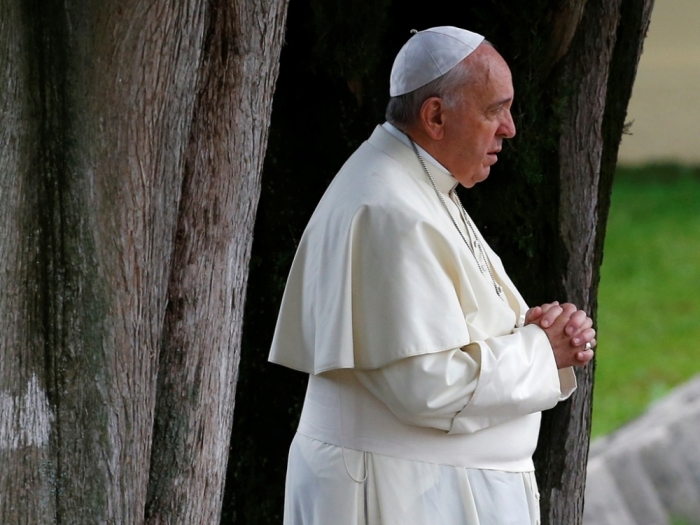 Pope Francis prays at the Austro-Hungarian cemetery of Fogliano in Redipuglia, Italy, September 13, 2014. Pope Francis marked the centenary of World War I at the Redipuglia Military Sacrarium with a mass.