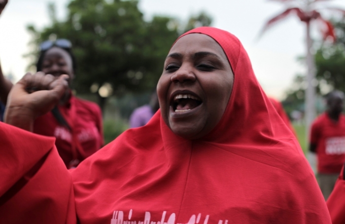 A campaigner from '#Bring Back Our Girls' shouts during a rally calling for the release of the Chibok school girls who were abducted by the Boko Haram militants, in Abuja, Nigeria, October 17, 2014. Nigeria said on Friday it had agreed a ceasefire with Islamist militants Boko Haram and reached a deal for the release of more than 200 schoolgirls kidnapped by the group six months ago.