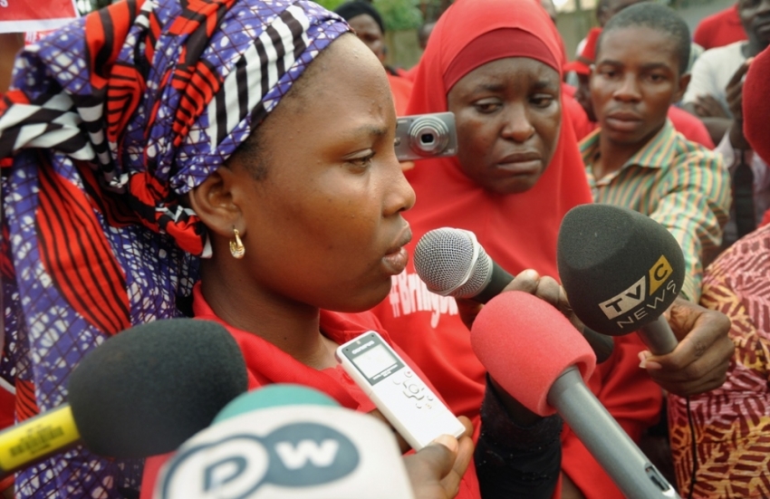 Isaac Rebecca, one of the girls that escaped from the Boko Haram camp, speaks during a protest, in continuation of the Global Week of Action to commemorate six months since the abduction of the 219 Chibok school girls, organized by the Abuja "Bring Back Our Girls protest group to the Presidential Villa, in Abuja, Nigeria, October 14, 2014.