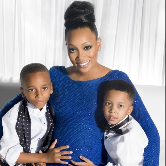 Singer Monica Brown is pictured with two of her three children.