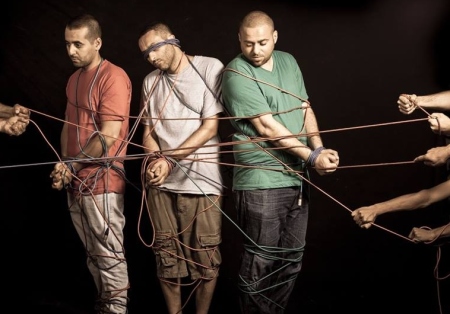 A picture of an exhibition named "Room No. 4" featured at Domkerk Church in Utrecht, Netherlands, that shows adults portraying imprisoned Palestinian children, October 2014.