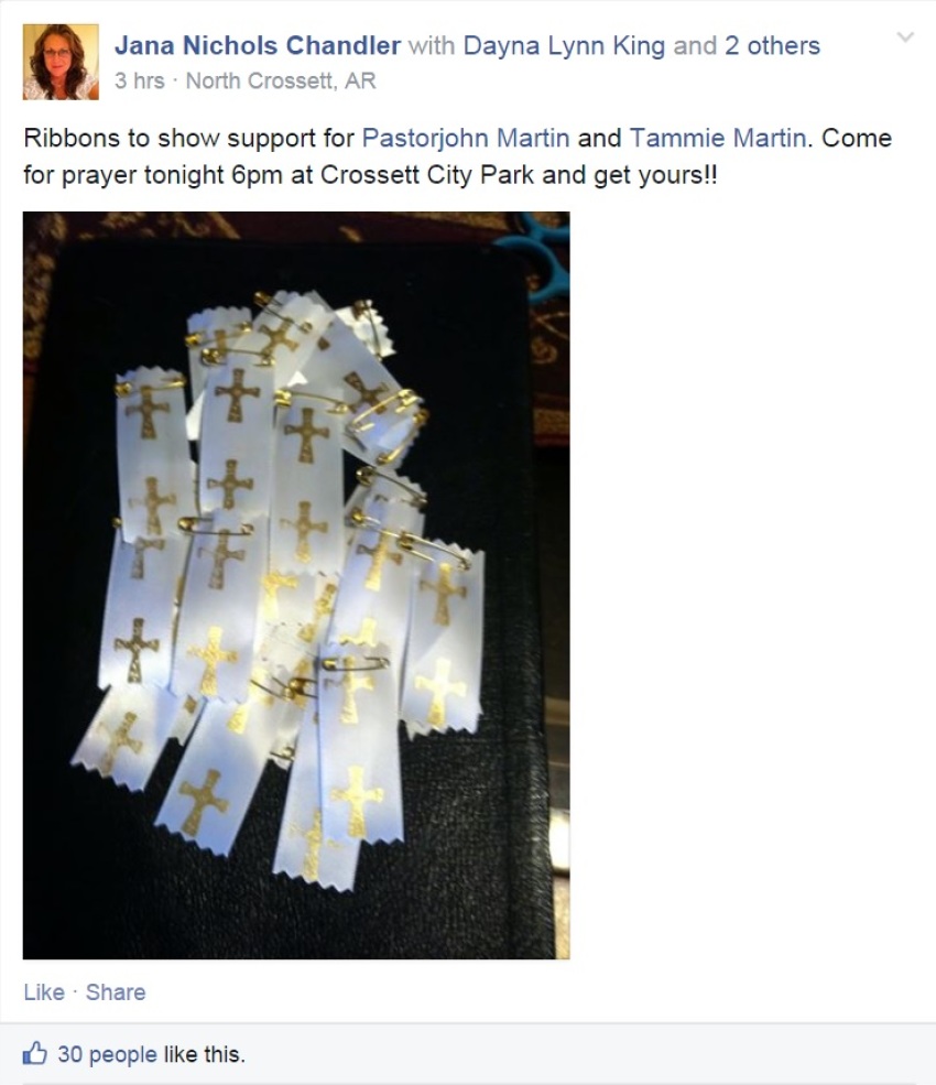 Arkansas church members organized a prayer meeting in a local park and crafted white "prayer ribbons" with gold crosses to support Cloverdale Assembly of God Church pastor John Martin and his wife Tammie as they travel to West Africa despite concerns about the spread of Ebola in the continent.