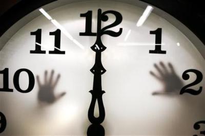 Credit : Technicians work on a five-foot tower clock at the Electric Time Company in Medfield, Massachusetts March 31, 2006.