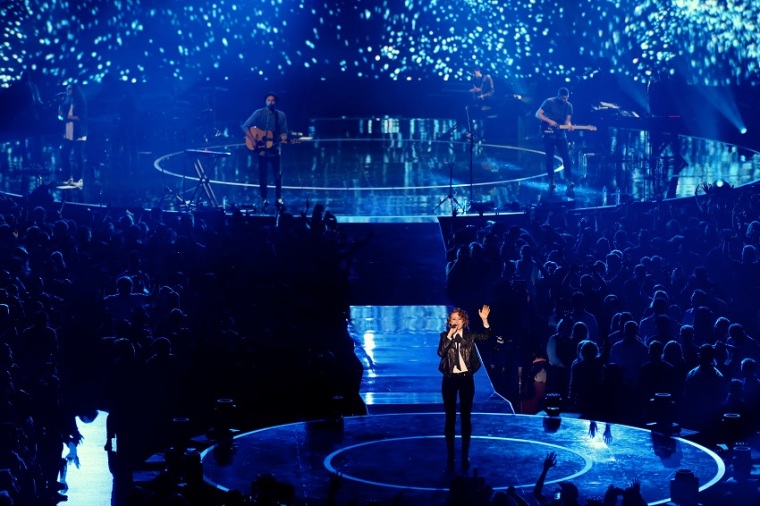 Hillsong worship singer Taya Smith sings from the middle of the Forum arena, October 23, 2014.