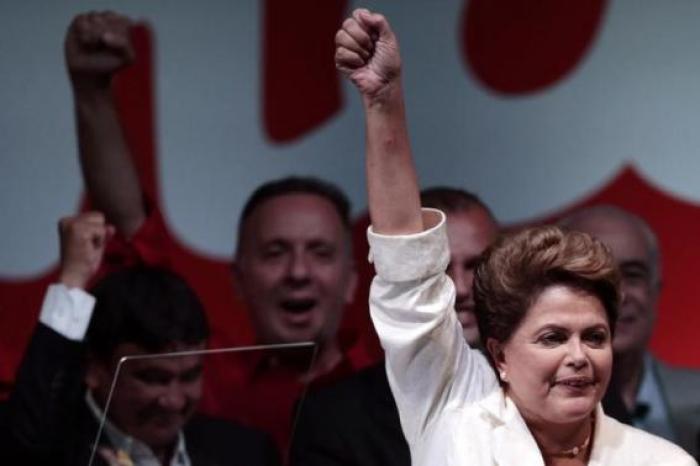 Brazil's President and Workers' Party (PT) presidential candidate Dilma Rousseff celebrates during news conference after disclosure of the election results, in Brasilia October 26, 2014.