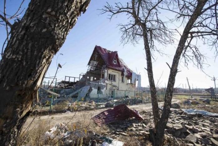 A house damaged by recent shelling is seen in the village of Semyonovka near Slaviansk, eastern Ukraine, October 27, 2014.