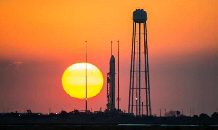 The Orbital Sciences Corporation Antares rocket, with the Cygnus spacecraft onboard, is seen on launch Pad-0A at sunrise at NASA's Wallops Flight Facility, Virginia, October 26, 2014.
