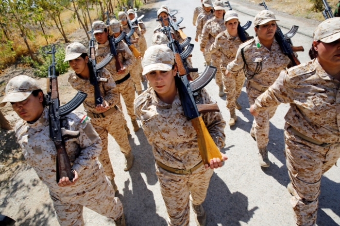 Kurdish Peshmerga female fighters march during combat skills training before being deployed to fight the Islamic State at their military camp in Sulaimaniya, northern Iraq, September 18, 2014.