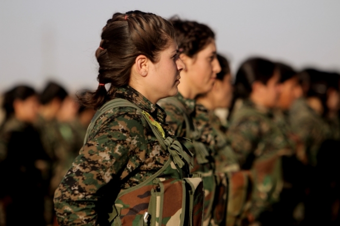 Kurdish female fighters of the Women's Protection Unit participate in training at a military camp in Ras al-Ain city in Hasakah province, June 30, 2014.