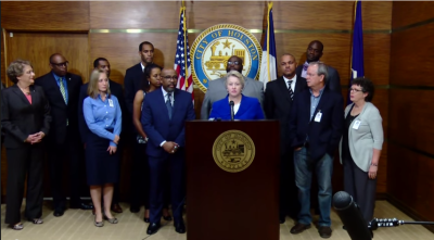 Houston Mayor Annise Parker (at podium) announces the withdrawal of subpoenas for the sermons of five local pastors at a press conference on Wednesday October 30, 2014.