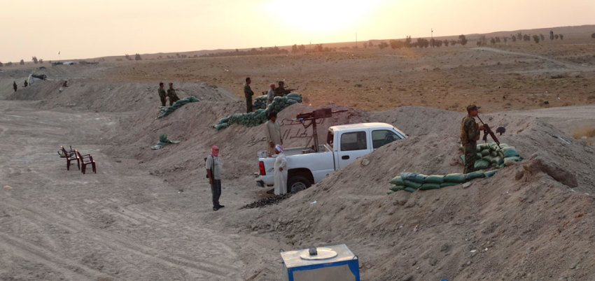 Tribal fighters look on as they take part in an intensive security deployment against Islamic State militants in the town of Amriyat al-Falluja,in Anbar province, October 31, 2014. Picture taken October 31, 2014.