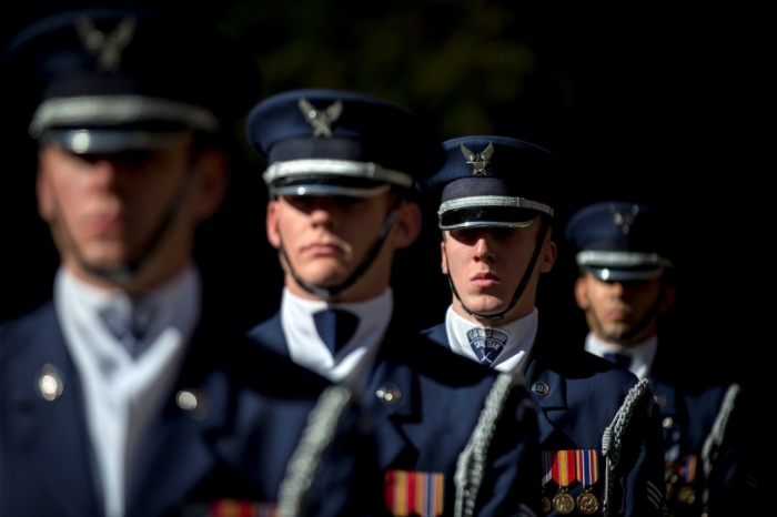 Members of the U.S. Air Force Honor Guard stand at attention at the 9/11 Memorial in New York November 10, 2014. The 9/11 Memorial is holding a Salute to Service, a five day tribute to veterans for Veterans Day.