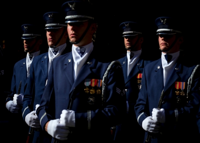 Members of the U.S. Air Force Honor Guard stand at attention at the 9/11 Memorial in New York, November 10, 2014. The 9/11 Memorial is holding a Salute to Service, a five day tribute to veterans for Veterans Day.