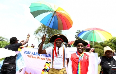 People walk in a parade to celebrate the annulment of an anti-homosexuality law by Uganda's constitutional court in Entebbe, August 9, 2014.