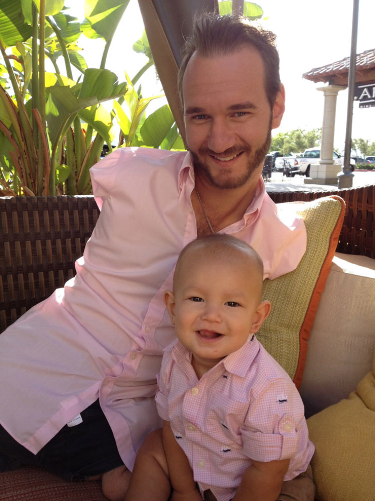 Limbless evangelist and inspirational speaker Nick Vujicic with his son, Kiyoshi.