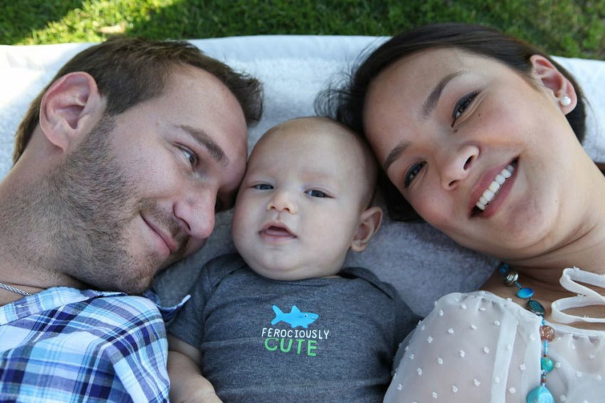 Limbless evangelist and inspirational speaker Nick Vujicic with his son, Kiyoshi, and his wife, Kanae.