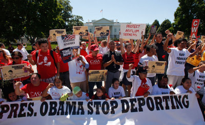 Anti-deportation protesters chant in front of the White House in Washington August 28, 2014. The protest, organized by CASA, a non profit organization assisting immigrants, called on President Obama to stop deporting undocumented workers, parents and children.