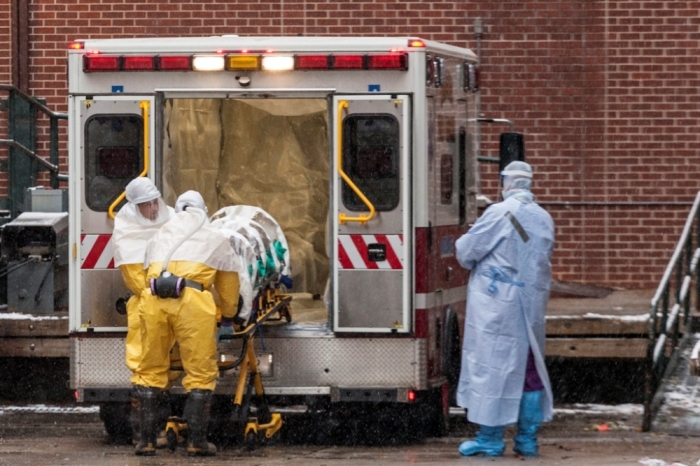 Dr. Martin Salia is placed on a stretcher upon his arrival at the Nebraska Medical Center Biocontainment Unit in Omaha, Nebraska, November 15, 2014. The Sierra Leonean surgeon who is critically ill with Ebola was flown to the United States from West Africa on Saturday and was transported to a Nebraska Medical Center for treatment, hospital officials said. Salia, 44, a permanent U.S. resident, caught Ebola working as a surgeon in a Freetown hospital, according to his family.