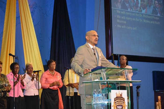 Dave Burrows (podium), the new senior pastor of Myles Munroe's Bahamas Faith Ministries.