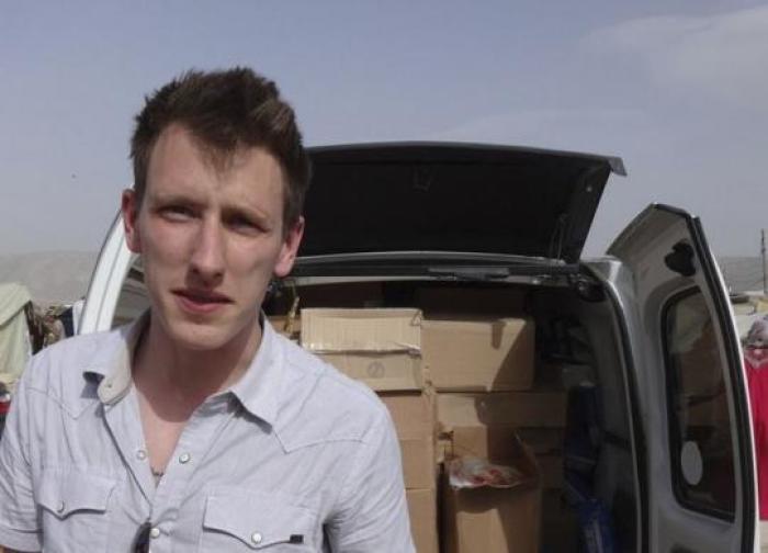 Abdul-Rahman (Peter) Kassig is pictured making a food delivery to refugees in Lebanonâ€™s Bekaa Valley in this May 2013 handout photo released by his family November 16, 2014.