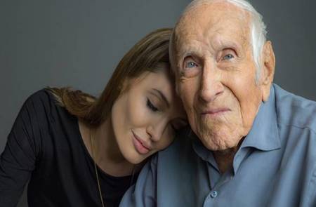 Louis Zamperini with "Unbroken" Director Angelina Jolie