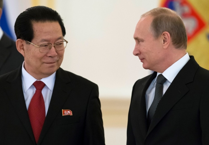 Russian President Vladimir Putin (R) and new North Korea's Ambassador Kim Hyun-joon attend a ceremony to hand over credentials at the Kremlin in Moscow, November 19, 2014. Russia is ready for cooperation with the United States, provided it is based on respect for each others' interests and non-interference in domestic affairs, President Vladimir Putin said on Wednesday.