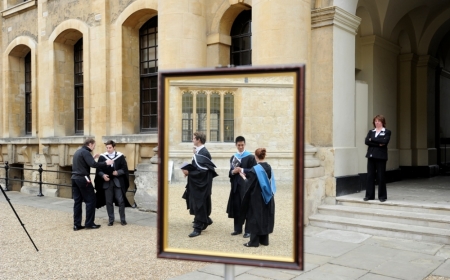 Graduates are seen queueing to have their photograph taken after a graduation ceremony at Oxford University, Oxford, southern England in this May 28, 2011 file photograph.