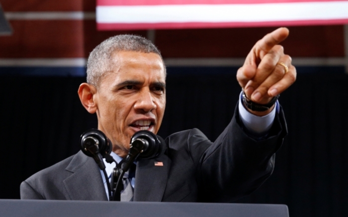 U.S. President Barack Obama speaks about immigration reform during a visit to Del Sol High School in Las Vegas, Nevada, November 21, 2014. Obama imposed the most sweeping immigration reform in a generation on Thursday, easing the threat of deportation for about 5 million illegal immigrants.
