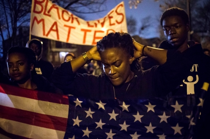 Protesters, demanding the criminal indictment of a white police officer who shot dead an unarmed black teenager in August, march through a suburb in St. Louis, Missouri. November 23, 2014. After a fourth straight night of low-level protests in Ferguson, Missouri, anxious residents still did not know on Sunday when a grand jury would return a decision on whether to charge a white policeman who shot an unarmed black teen to death this summer. It appeared that the St. Louis suburb, which has become a flashpoint for U.S. race relations since Officer Darren Wilson killed 18-year-old Michael Brown on Aug. 9, would have to wait until at least Monday and perhaps longer for an announcement.